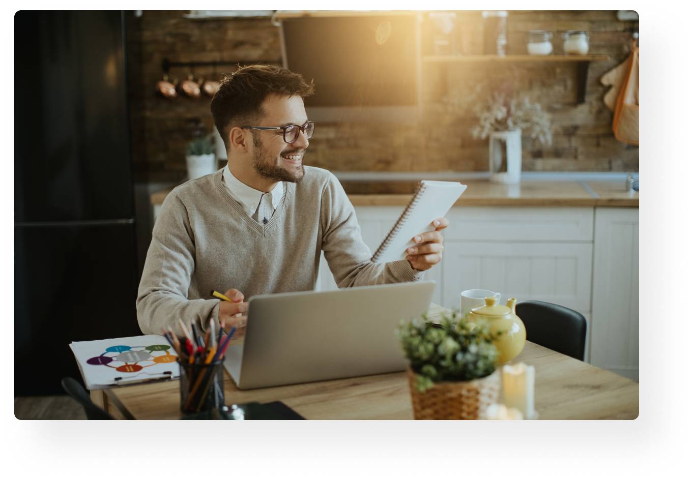 professional man smiling at notebook