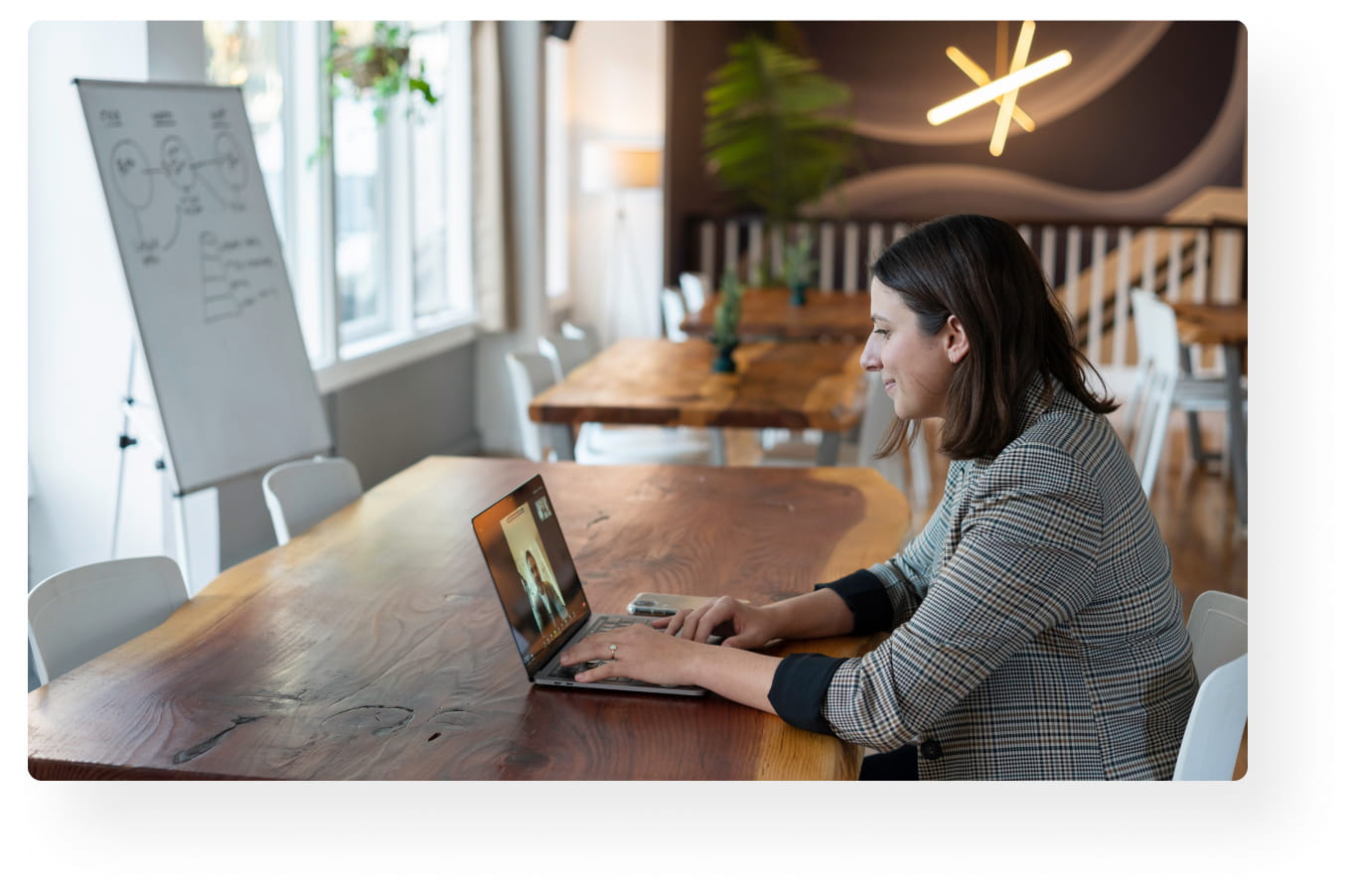 financial advisor engaging with prospective client on laptop